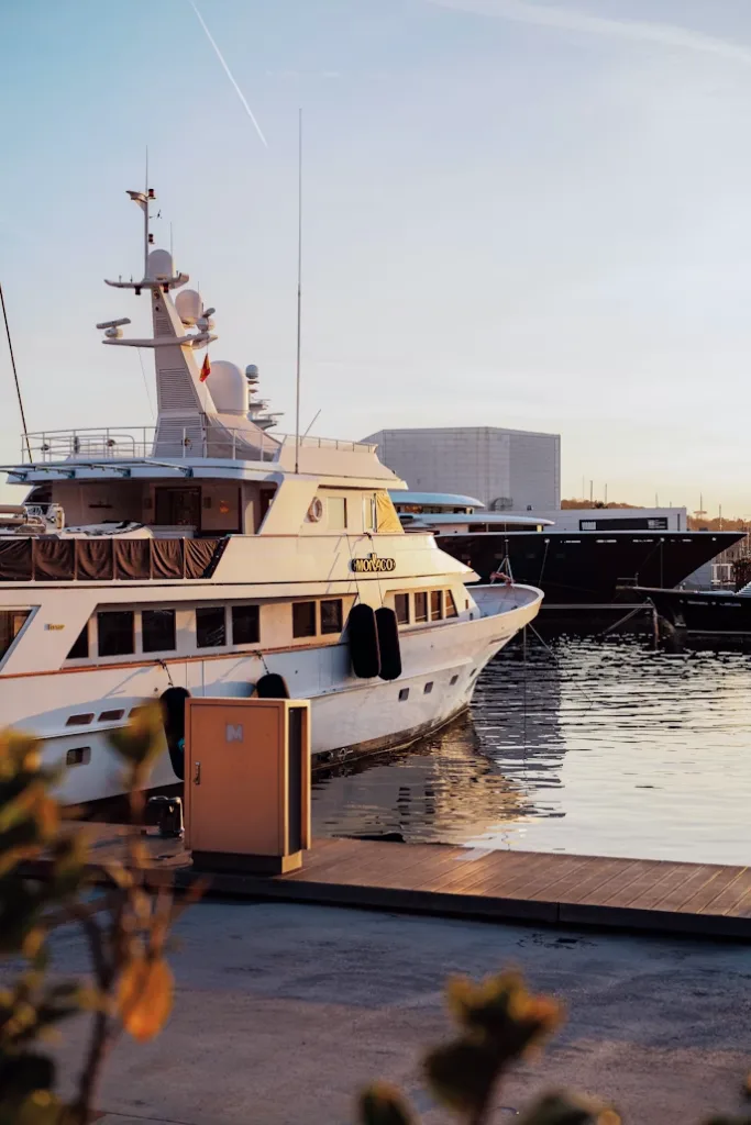 Motor yacht berthed at the dock at sunset
